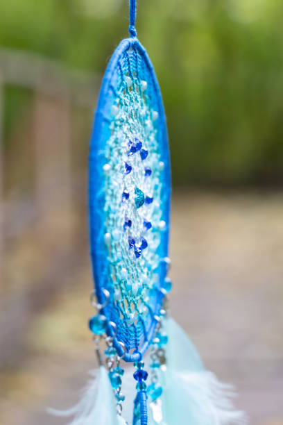 Dream catcher with feathers threads and beads rope hanging. Dreamcatcher handmade