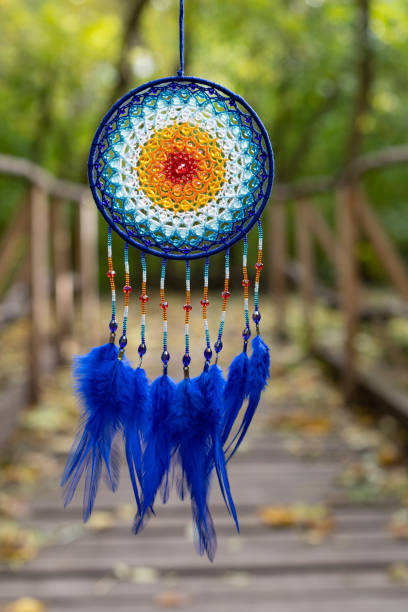 istock Handmade dream catcher with feathers threads and beads rope hanging 2060180620