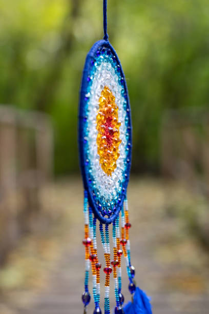 istock Handmade dream catcher with feathers threads and beads rope hanging 2060180624