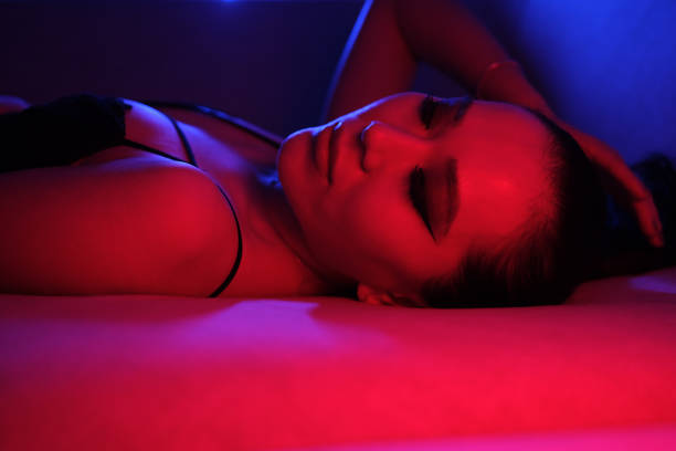istock Seductive Young Woman in Colorful Neon Lights 2060187798