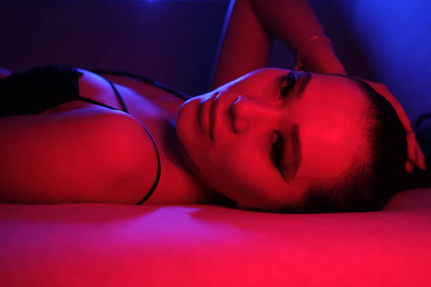 istock Seductive Young Woman in Colorful Neon Lights 2060188863