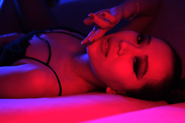 istock Seductive Young Woman in Colorful Neon Lights 2060188873