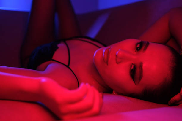 istock Seductive Young Woman in Colorful Neon Lights 2060189919
