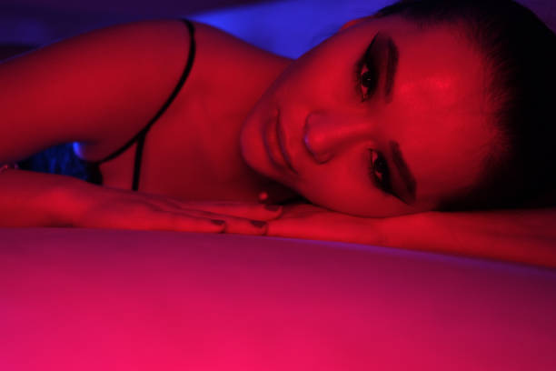 istock Seductive Young Woman in Colorful Neon Lights 2060192073