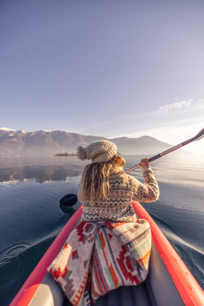 istock Rear view, female canoeing on spectacular mountain lake 2060195317