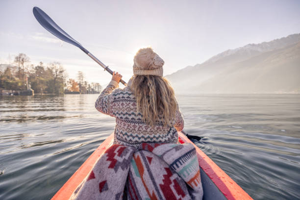 istock Rear view, female canoeing on spectacular mountain lake 2060195849