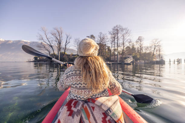 istock Rear view, female canoeing on spectacular mountain lake 2060196411