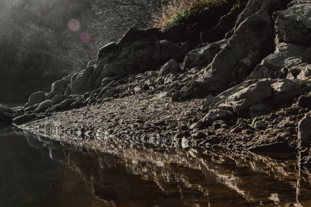 Small rocky beach along the river (Saint Victor sur Loire)
