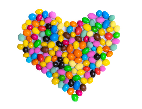 Heart-Shaped Candy Bean Creation With Sweet, Colorful, and Delightful Confections. A heart made out of candy beans on a white background