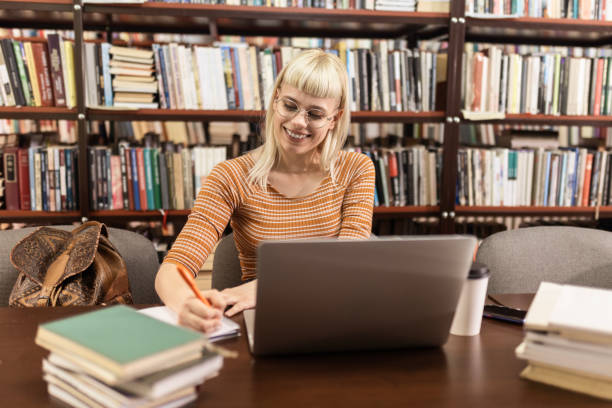 istock Female Student Immersed in Learning at Librar 2060219211