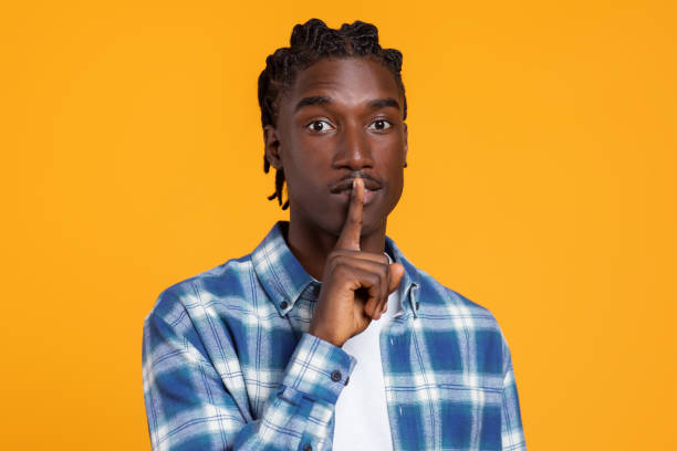 istock Keep Silence. Portrait Of Young Black Guy Showing Shh Gesture At Camera 2060223619
