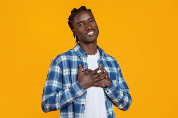 istock Gratitude Concept. Thankful African American Guy Keeping Both Palms On Chest 2060224182