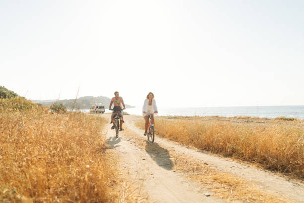 istock Young family exploring coastline on bicycles in summertime 2060251127