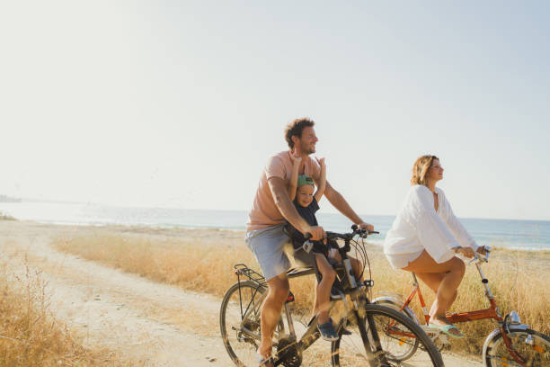 istock Young family exploring coastline on bicycles in summertime 2060252224