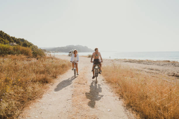 istock Young family exploring coastline on bicycles in summertime 2060255047
