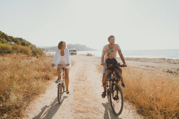 istock Young family exploring coastline on bicycles in summertime 2060256098