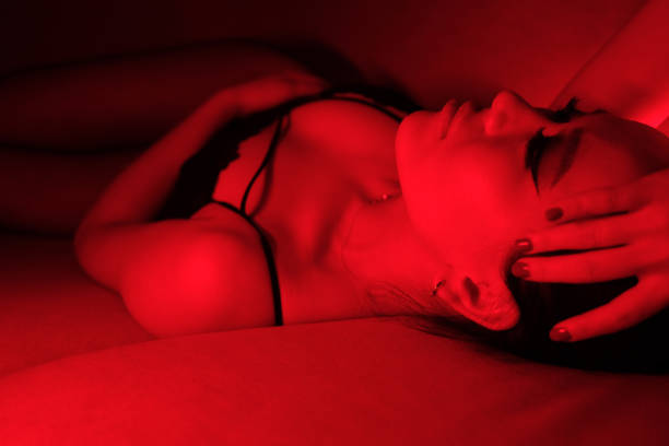 istock Seductive Young Woman in Red Neon Lights 2060259881