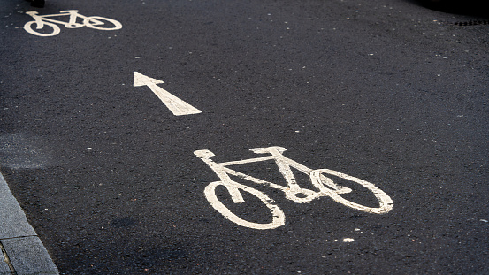 Bicycle lane sign on asphalt