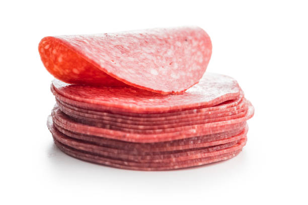Sliced salami sausage isolated on the white background.