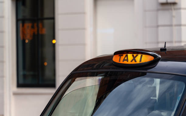 istock Taxi with it's sign on ready for hire 2060271047