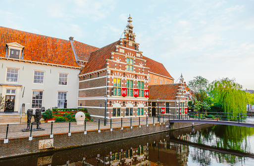 Strasbourg, France – October 16, 2021: Traditional wooden patterned houses on a canal in the downtown of Strasbourg.