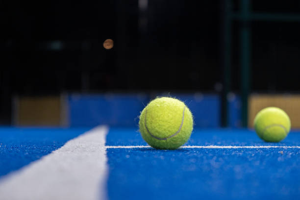 istock two ball on a paddle tennis court at night 2060283414