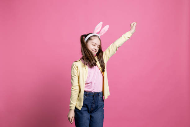 istock Positive enthusiastic girl fooling around and dancing on camera 2060285570