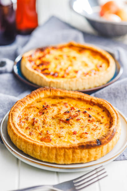 istock Traditional french pie. Quiche lorraine on white table. 2060289499