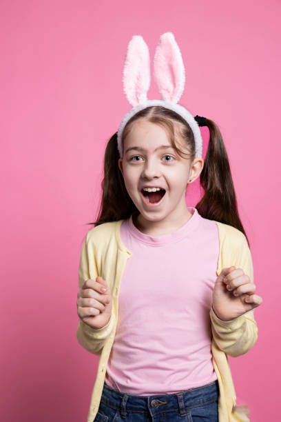 istock Young joyful toddler being surprised by easter festivity in studio 2060291736