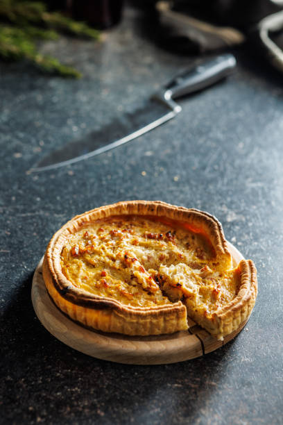istock Traditional french pie. Quiche lorraine on kitchen table. 2060293429