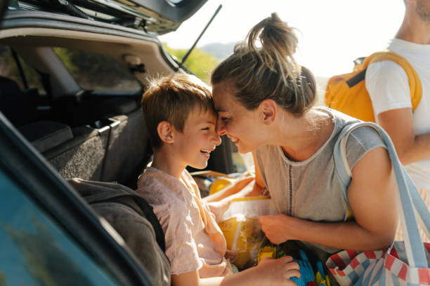 istock Unpacking my precious belongings from a car-trunk 2060305105