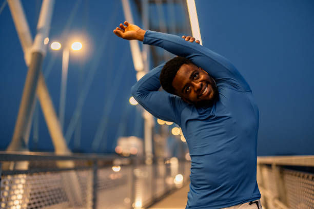 istock Man training and stretching body outdoors. 2060306831
