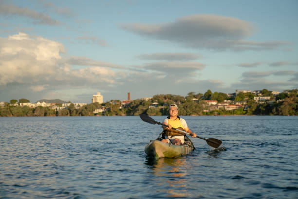 istock Smiling Asian Male Kayaking on Lake 2060311222