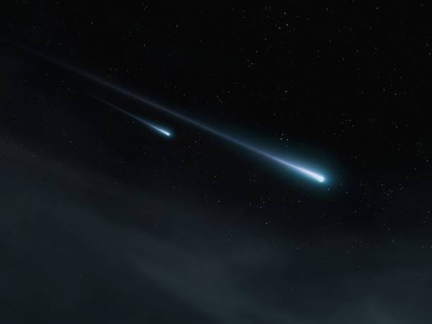 istock Two meteorites lit up the sky. Meteor shower, beautiful fireballs. 2060343591