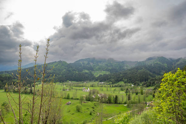 Zgornje Jezersko valley in Slovenia during a beautiful springtime day with the mountain range in the Kamnik–Savinja Alps.