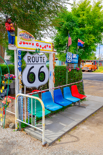 Seligman, Arizona, United States - September 22, 2023:  Colourful Chairs and Route 66 sign