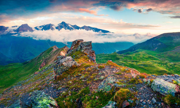 Summer morning view of Grossglockner mountain range from Grossglockner High Alpine Road. Colorful sunrise in Austrian Alps, Zell am See district, state of Salzburg in Austria, Europe. Artistic style post processed photo.