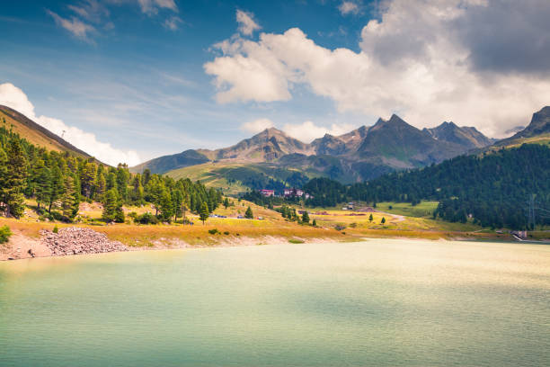 Beautiful summer morning on the Speicher lake. Colorful outdoor scene in western Austrian Alps, in the district of Innsbruck-Land in the state of Tyrol, Austria, Europe. Artistic style post processed photo.