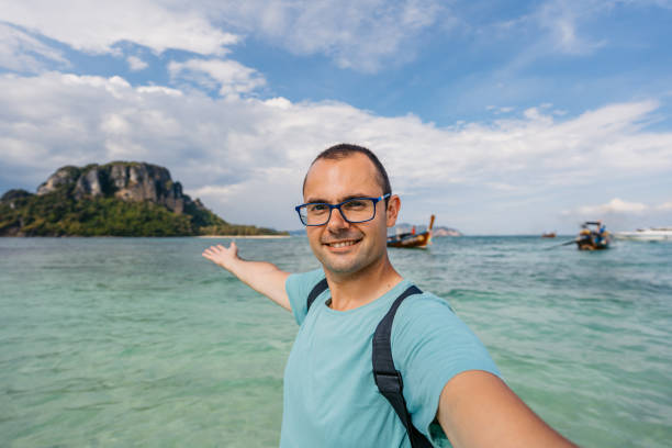 istock Young Man Taking Selfies On The Beach In Thailand 2060400816