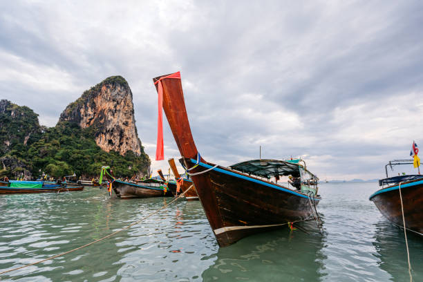 Boats on the Railay beach on the Andaman sea in Thailand.