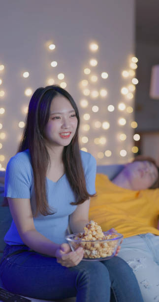 istock Asian couple watch TV home 2060401938