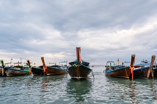 Boats on the beach on the Andaman sea in Thailand.