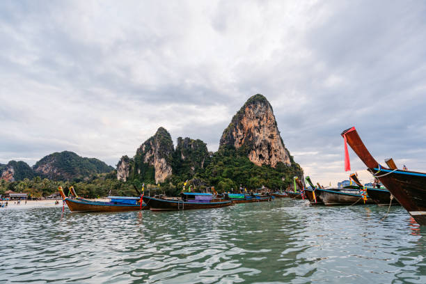 Boats on the Railay beach on the Andaman sea in Thailand.