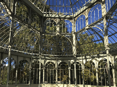 An interesting combination of glass and metal in Palacio de Cristal, originally a greenhouse, located in the de El Retiro Park in Madrid, Museu Nacional Centro de Arte Reina Sofia. Madrid, Spain.