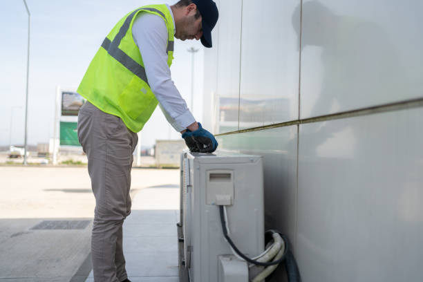 istock Man Doing Maintenance On Outdoor Air Conditioning Unit 2060418265
