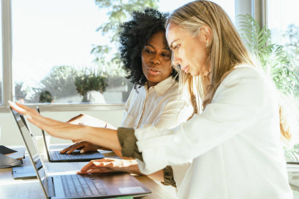 istock Two female colleagues working together in the office. 2060419342