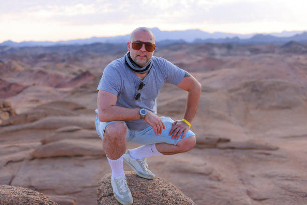 istock A middle aged brutal man at sunset in the desert 2060434861