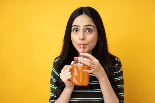 Photo of young girl wearing t-shirt isolated yellow background