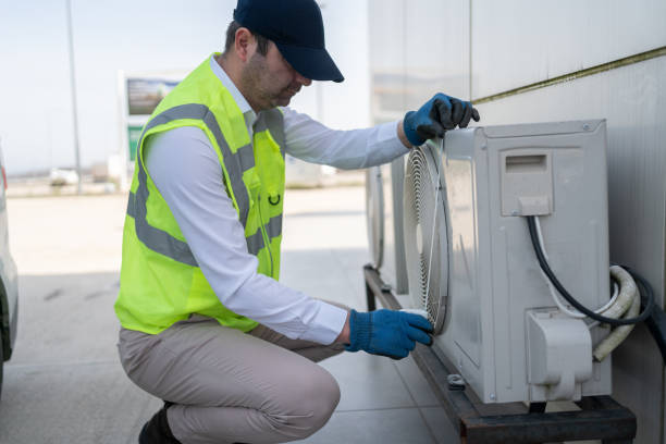 istock Man Servicing Outdoor Air Conditioning Unit 2060439215