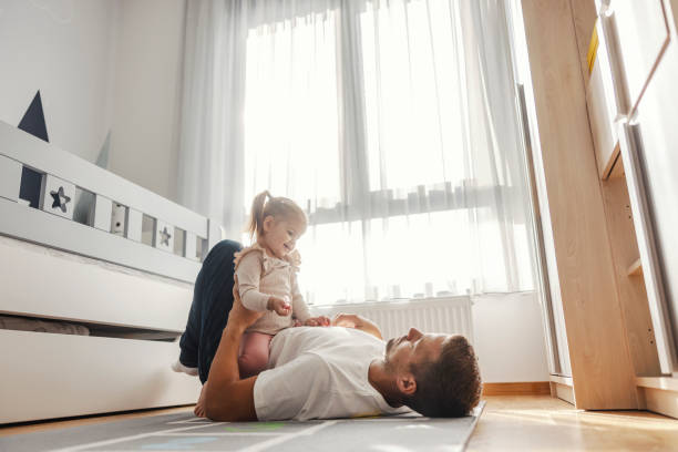 istock Dad and his girl playing at home. 2060445610